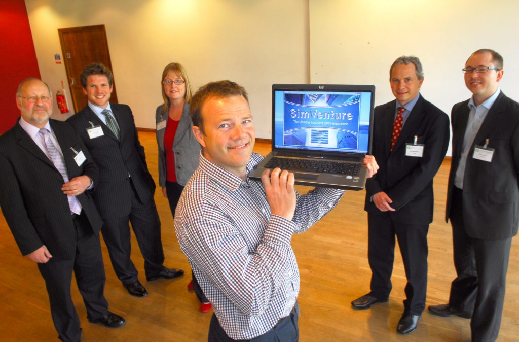 Sim Venture computor game event with, from left, Ron Godfrey, Business Editor of The press, James Teagle of Langleys, Tracey Smith of York Science Park, Paul Brough Jones (front) of Venture Simulations, Gary Butterfield of RBS and Paul Castle of Nat West. pic: Anthony Chappel-Ross