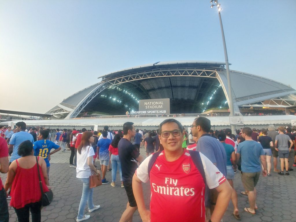 Partner agent portrait in front of a stadium. Join our Partner Agent team.