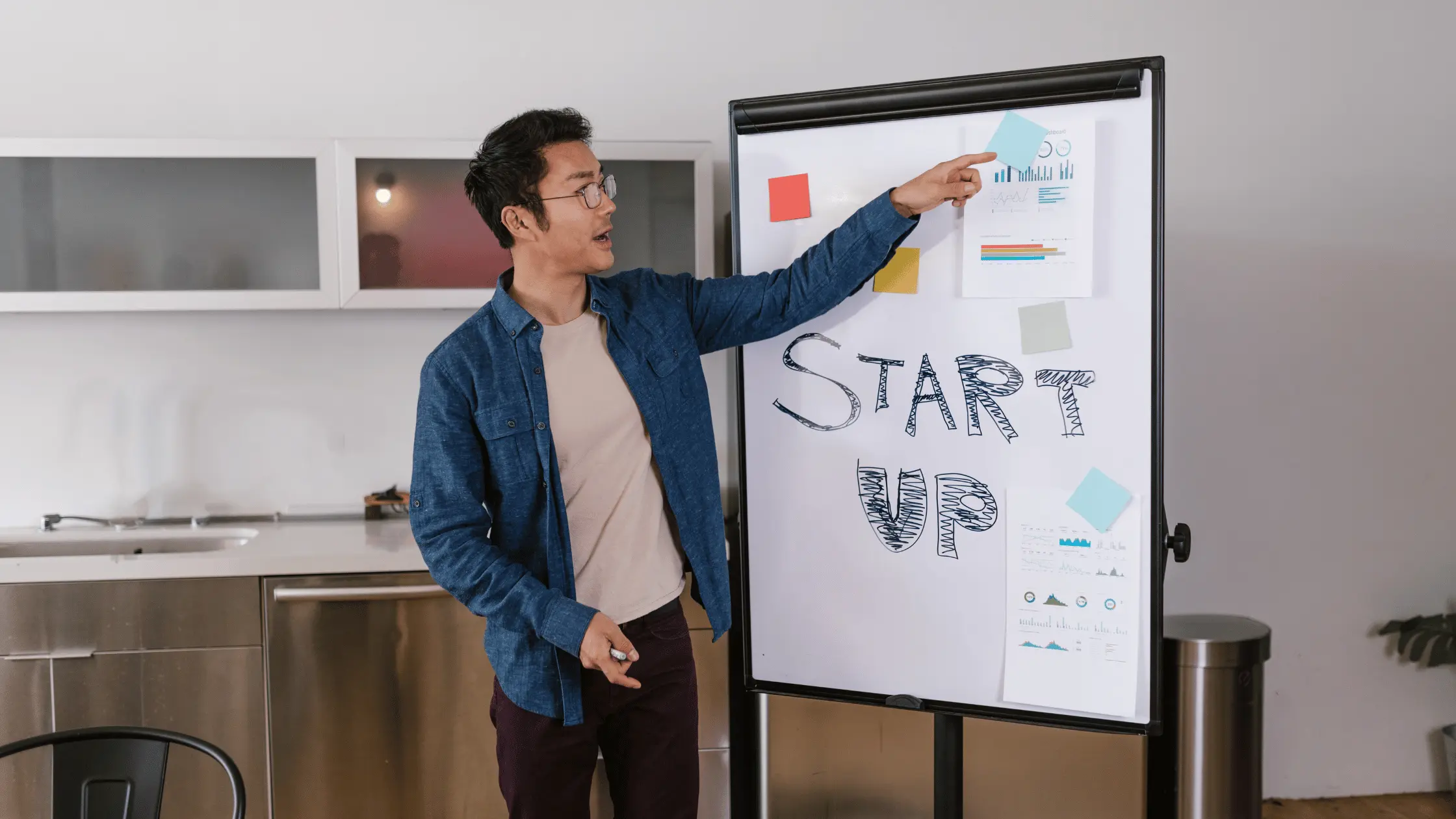 Entrepreneur planning their startup using the blocks of a Business Model Canvas