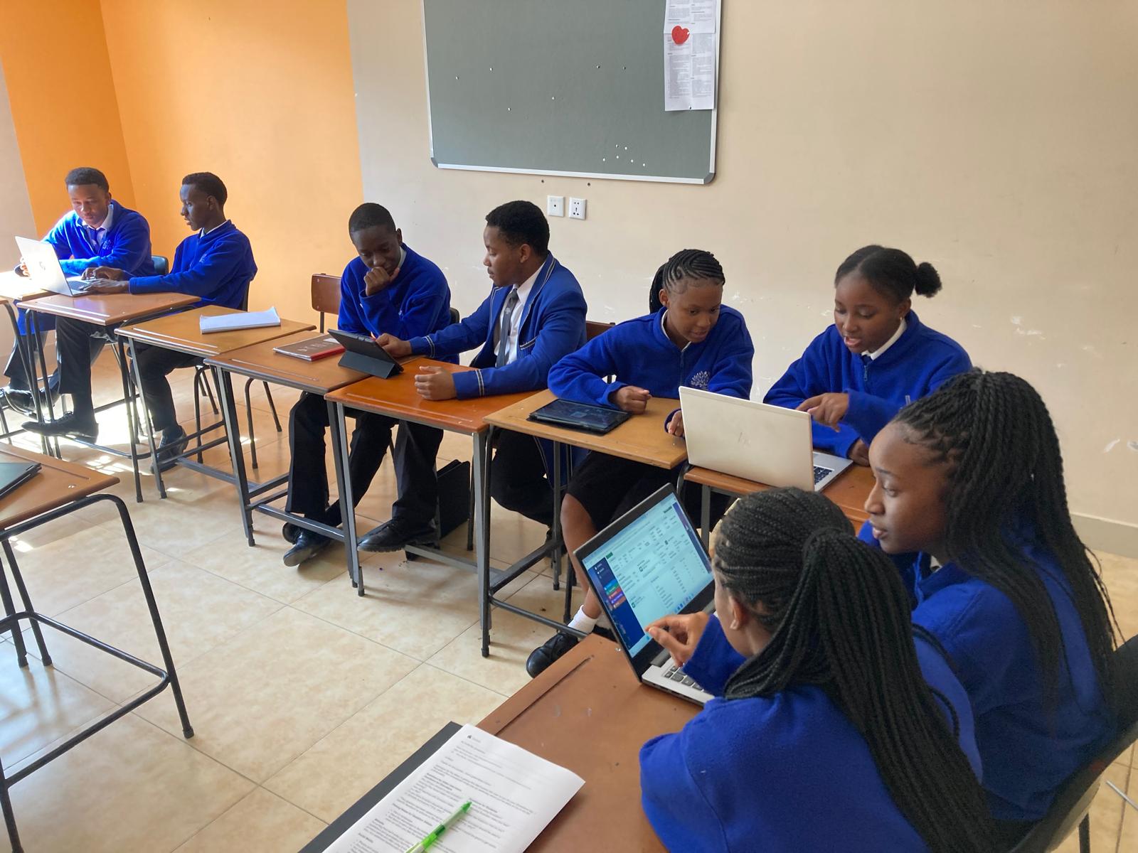 School Students at Oakwood Academy using Evolution, an online business simulation.