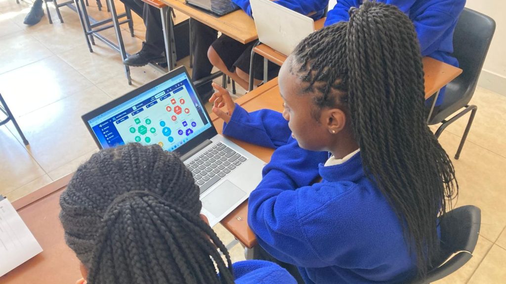 A classroom business simulation being used by students at a Cambridge School, Oakwood Academy in Zimbabwe. 